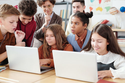 kids-on-laptops Safeguard the well-being of children in the digital age.